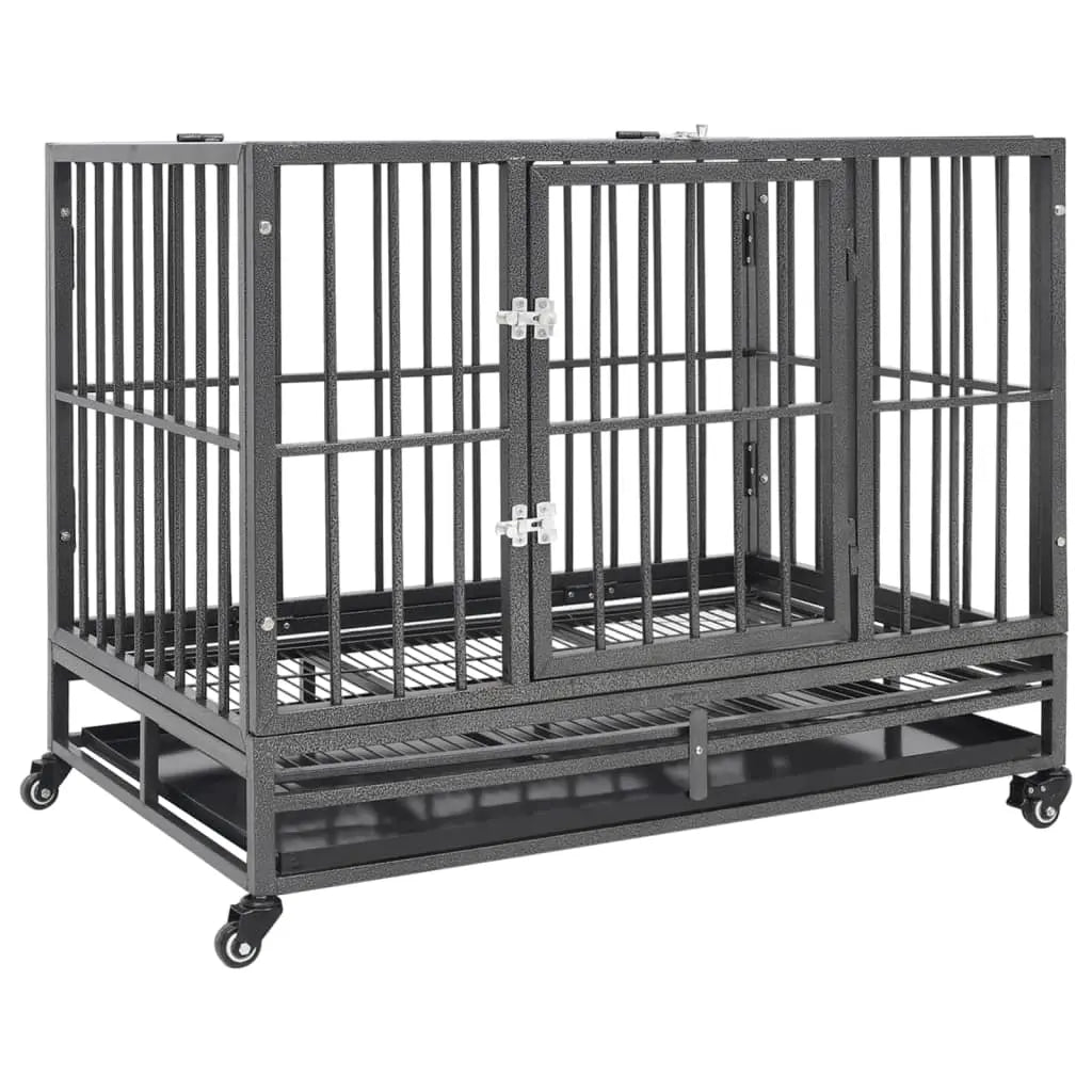 Black steel dog crate on four castor wheels with a hinged front door and removable tray, on a white background
