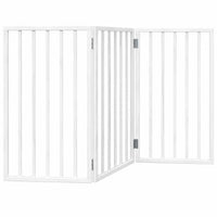 White freestanding dog gate standing in a living room doorway as an indoor pet barrier