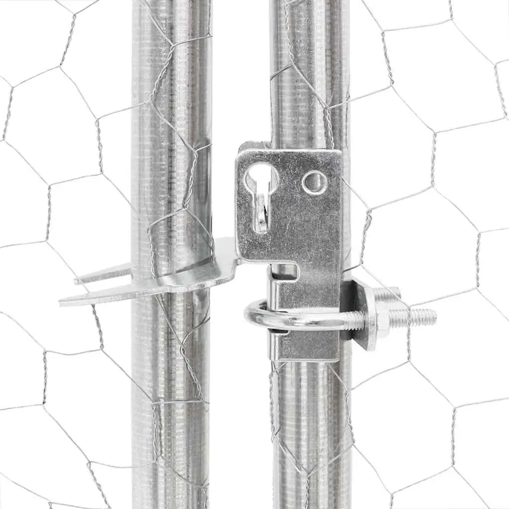 Close-up of the lockable metal catch on the hexagonal mesh dog run door