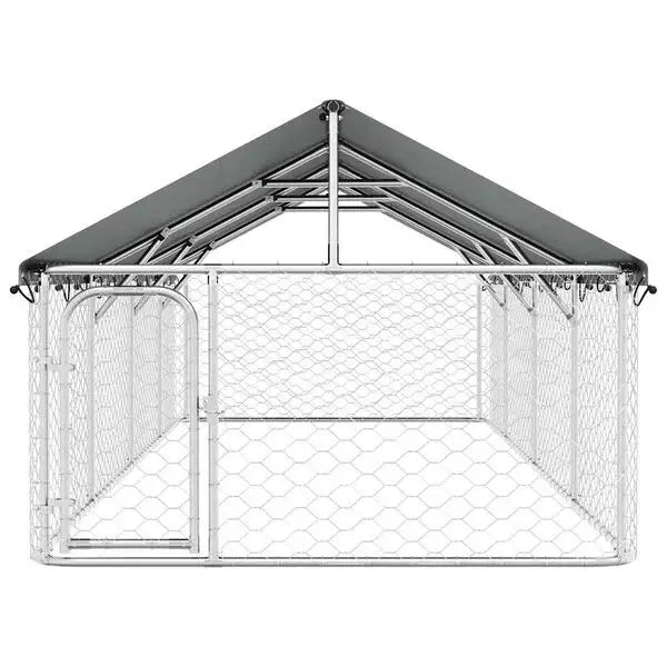 Front view of the galvanised steel dog kennel showing the pitched roof cover and hinged lockable gate