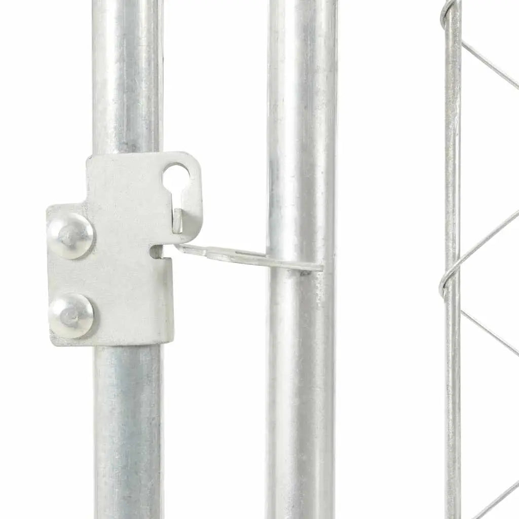 Close-up of a galvanised steel frame joint and chain-link mesh panel on the outdoor dog kennel