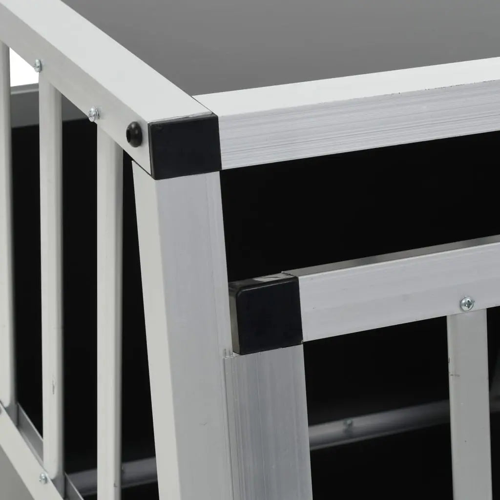 Close-up of the aluminium frame section and black plastic corner connector on the car dog crate