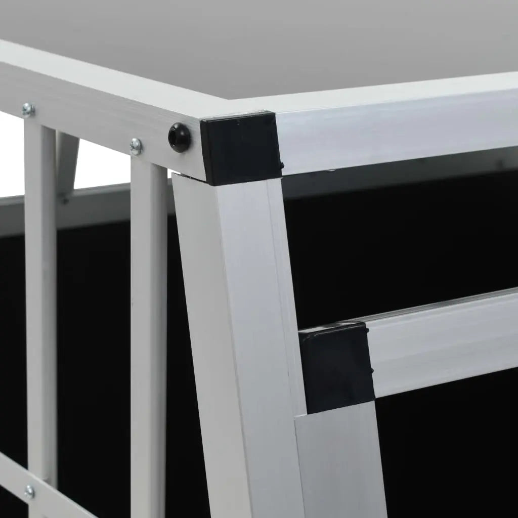 Close-up of an aluminium frame corner with black plastic connector on the double door car dog crate