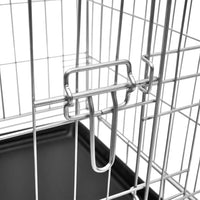 Close-up of the sliding metal door latch on the galvanised steel dog crate
