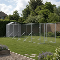 Large outdoor dog kennel run installed along garden fence, galvanized steel extended dog enclosure