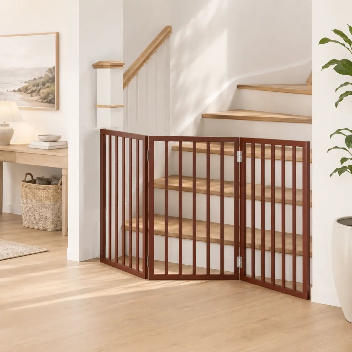Three-panel freestanding wooden dog gate positioned in the area at the foot of a staircase