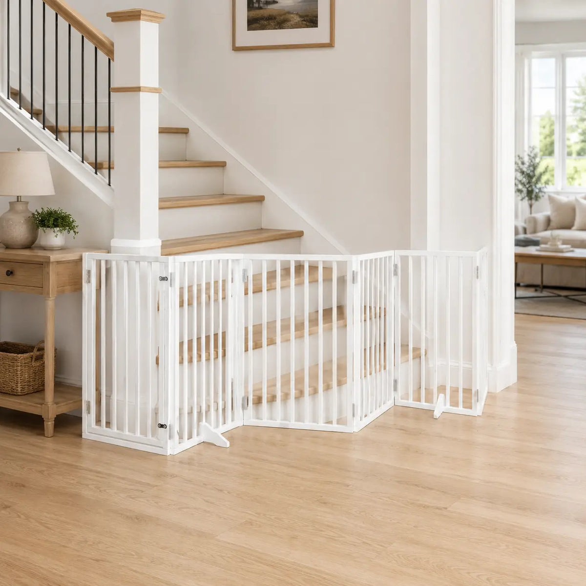 Tall six-panel freestanding wooden dog gate with door placed in the area at the foot of a staircase