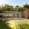 Six metre galvanised steel dog run set up on a garden lawn with a wooden shed behind
